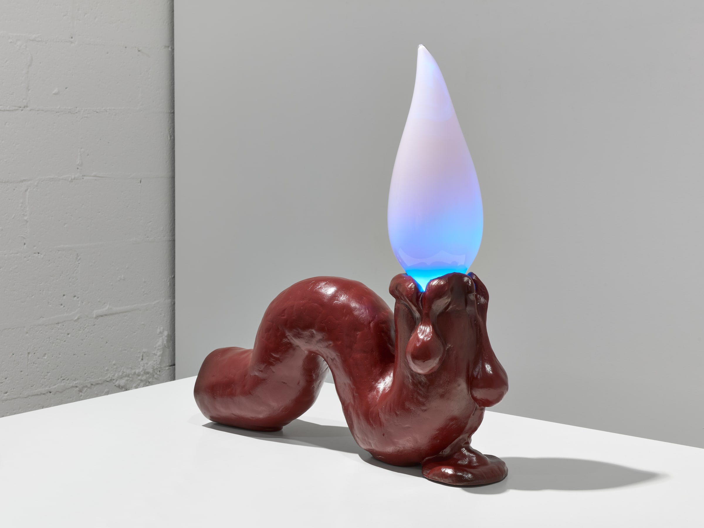 Tai Shani, Haunted by a Million Small Suns (Cardinal) (2025). Alternative studio angle showing the sculptural base and illuminated flame.