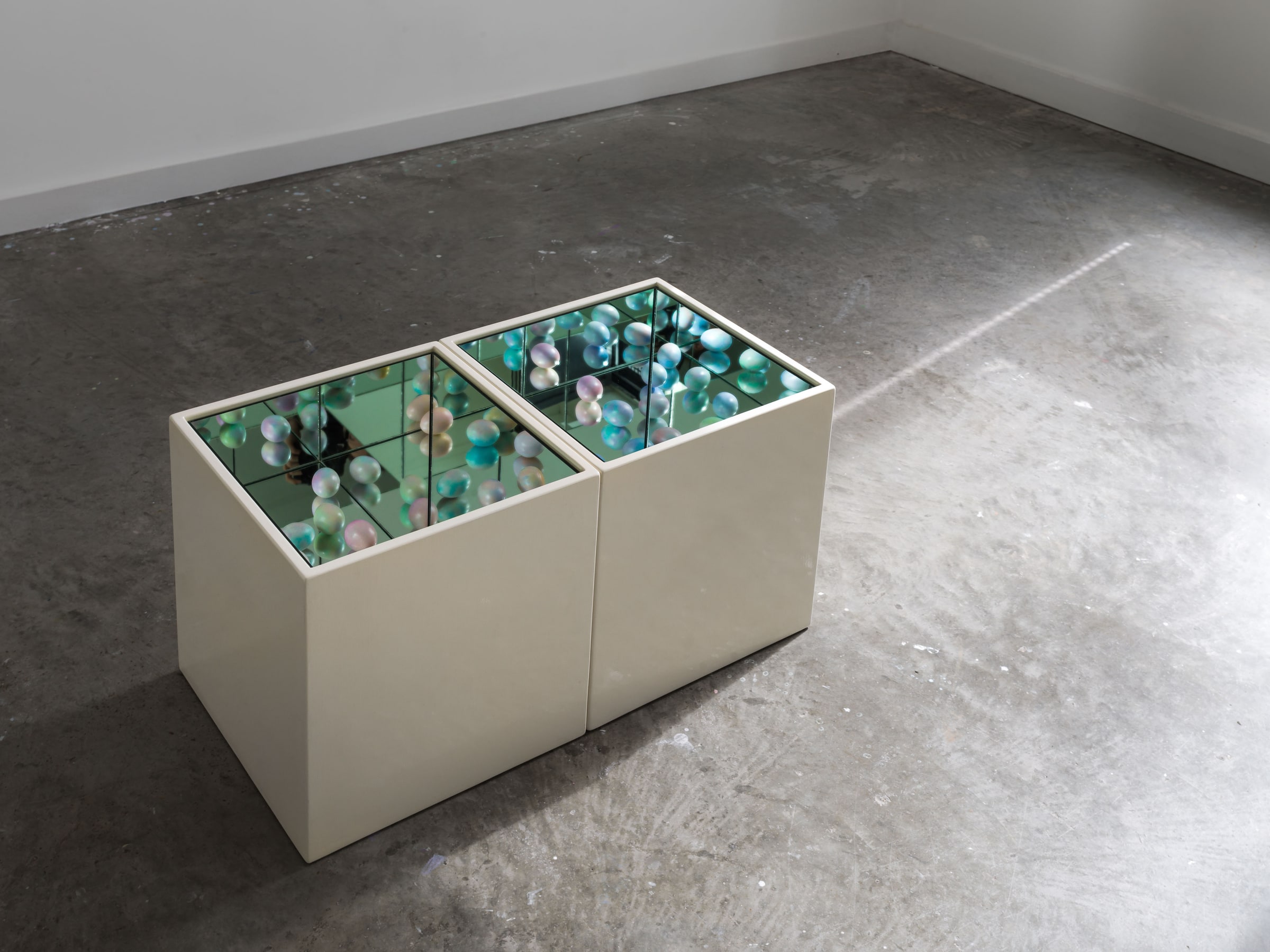 Yukako Shibata, Eggland I. Oblique view into the case, showing the arrangement of small objects.