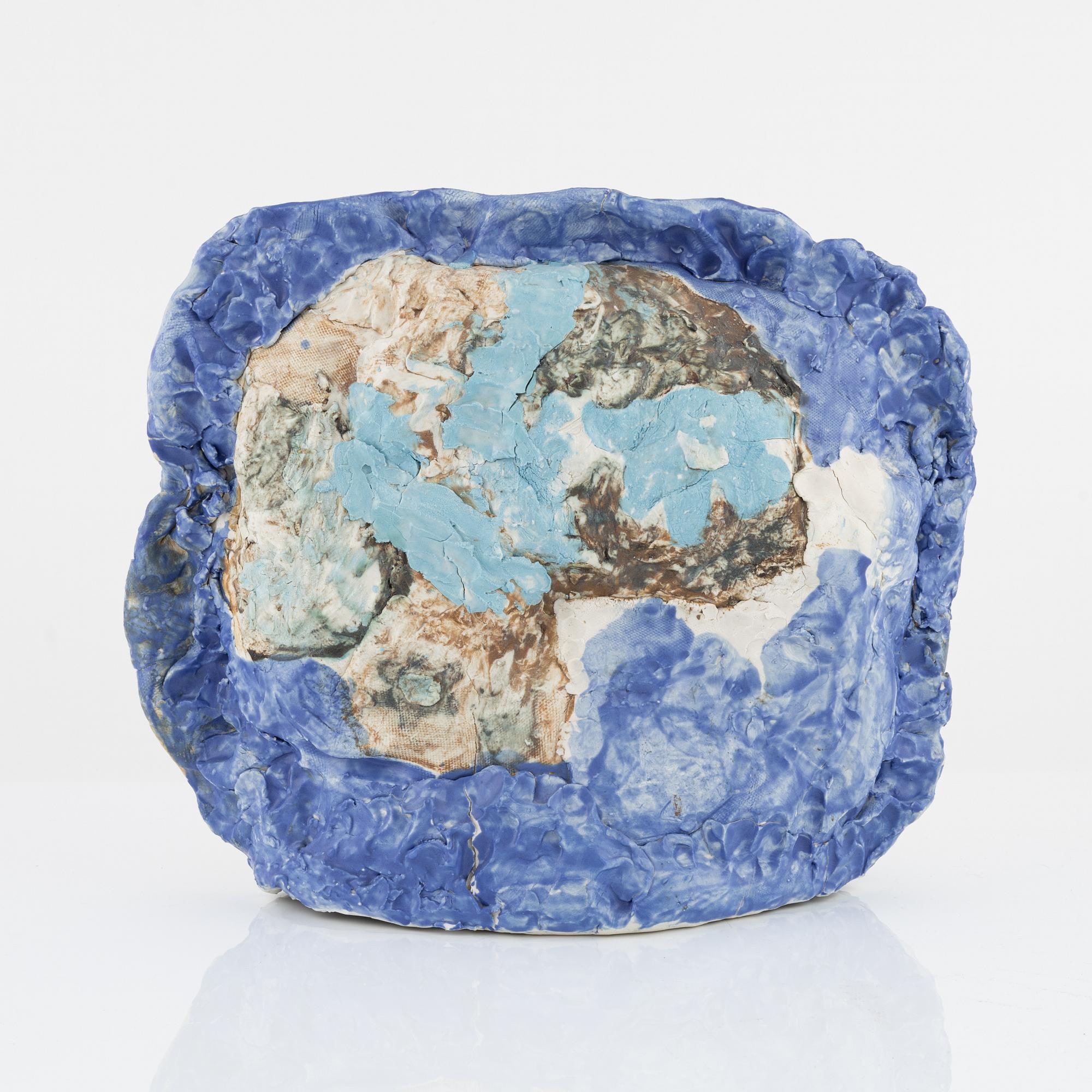 Tova Berglund, Untitled. Angled front view showing the blue edge and textured central form.