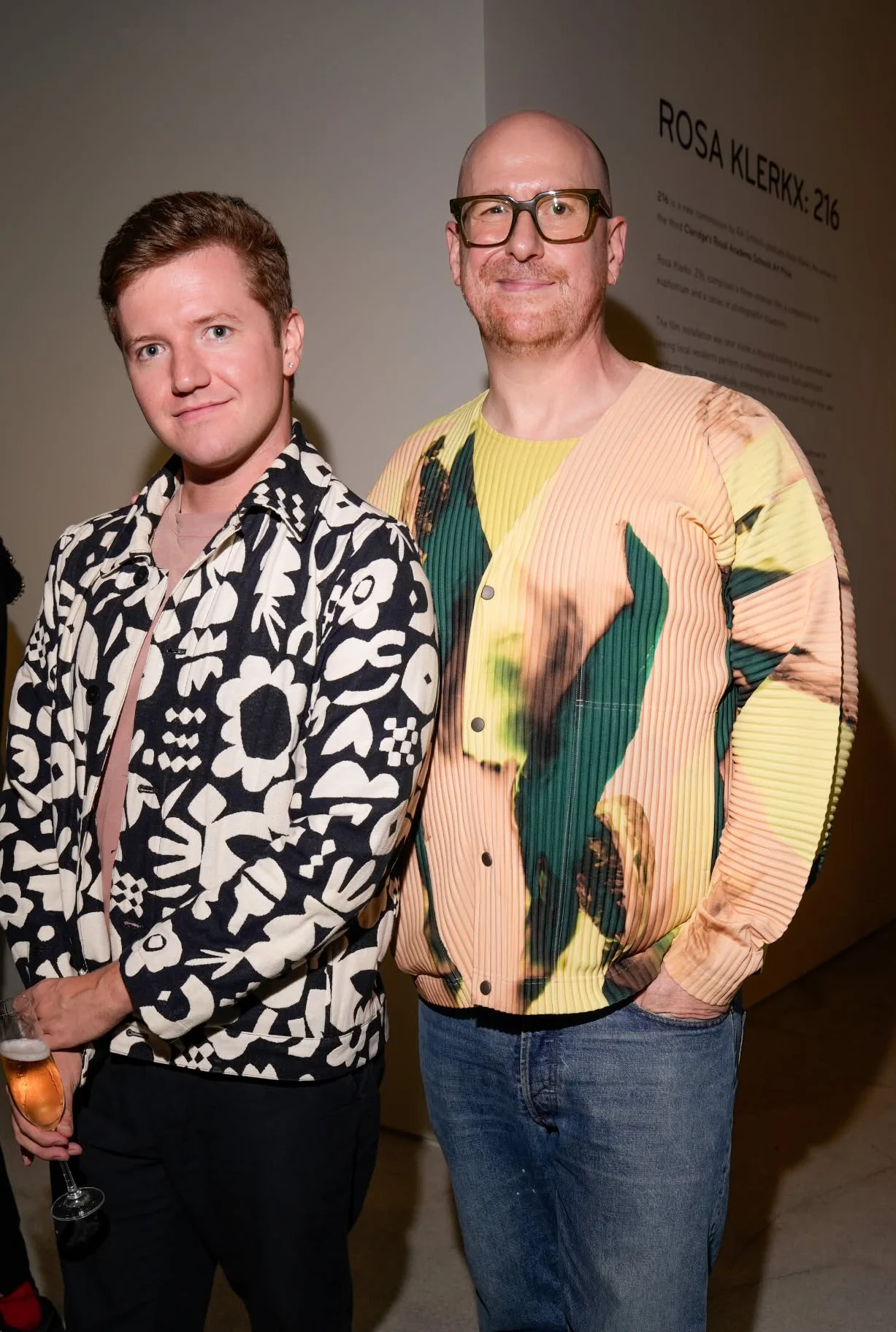 Joseph Clark on the left and Hugh Smithson-Wright on the right at Claridge’s ArtSpace, beside the Rosa Klerkx exhibition text