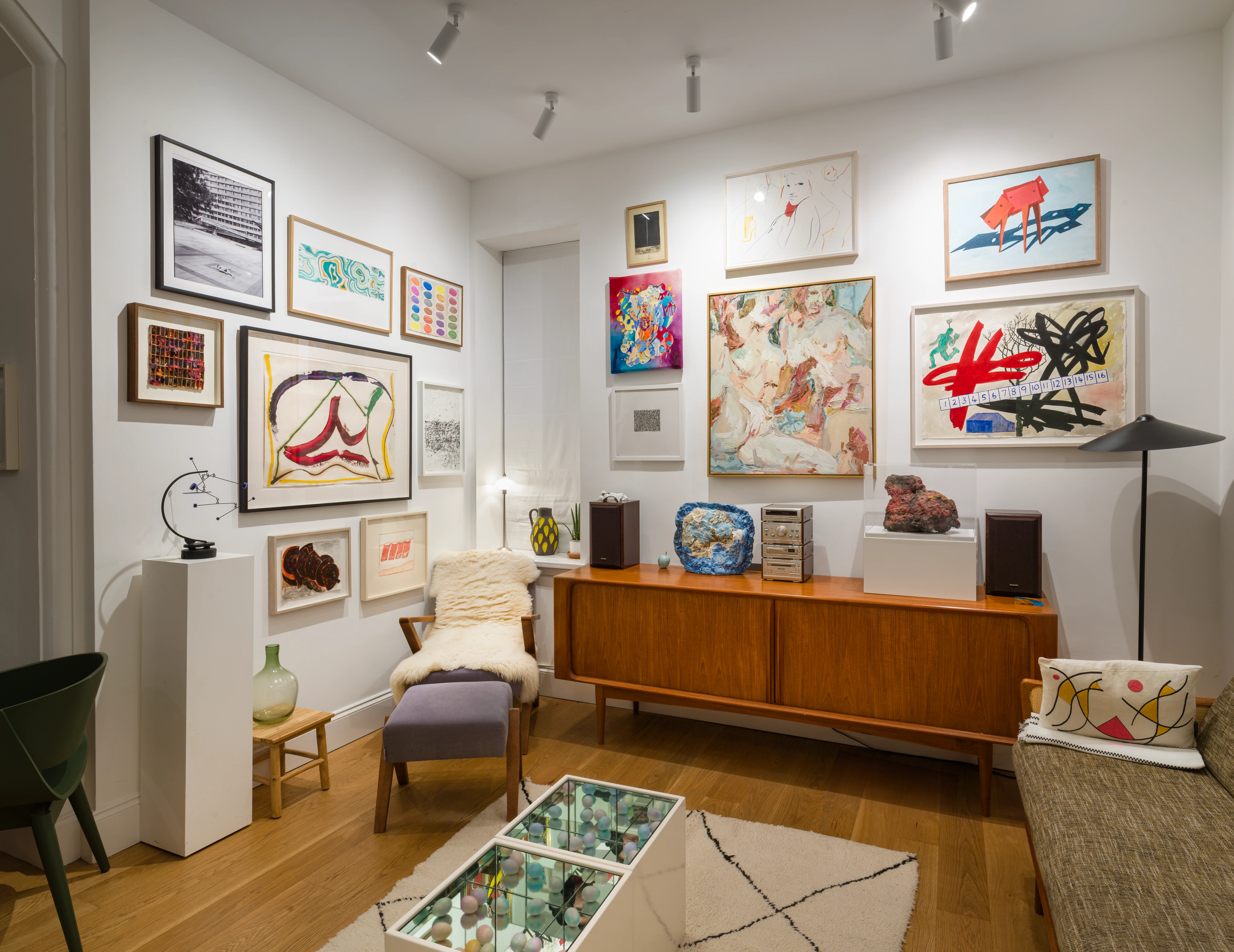 Paintings, works on paper and sculpture displayed together in a domestic interior in the Joseph Clark Collection